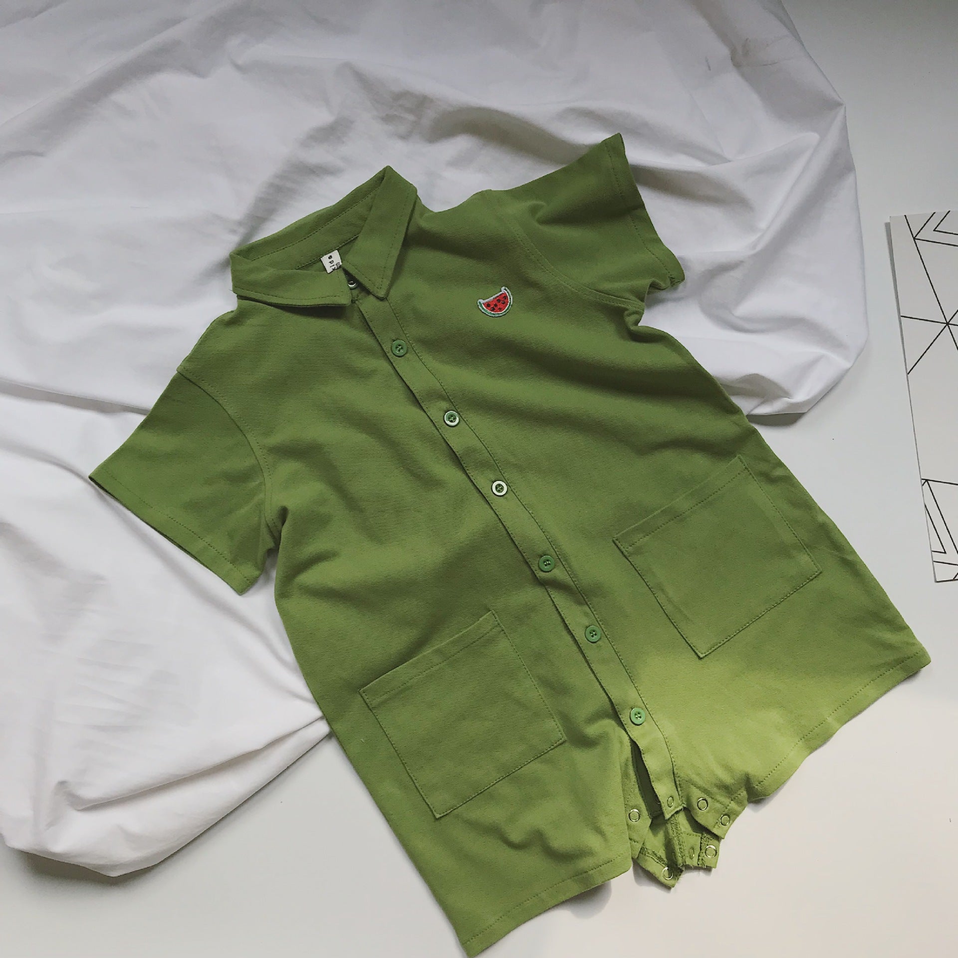 Children's jumpsuit with short sleeves and polo pockets