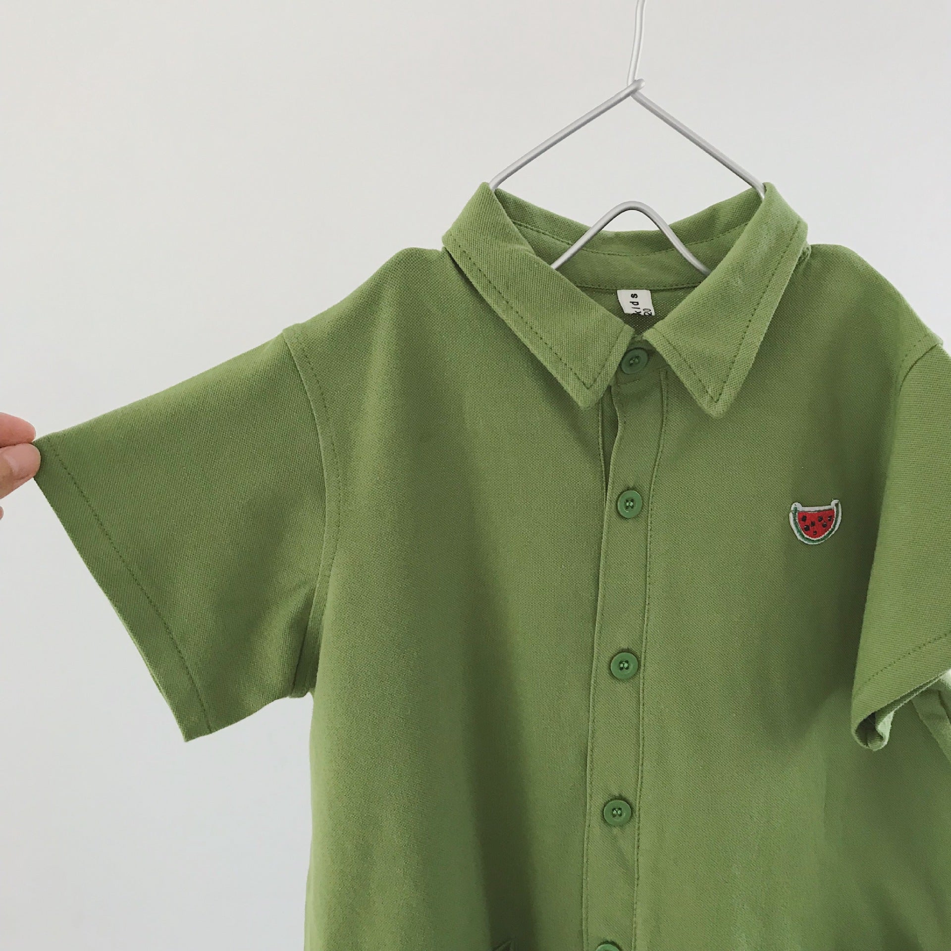 Children's jumpsuit with short sleeves and polo pockets